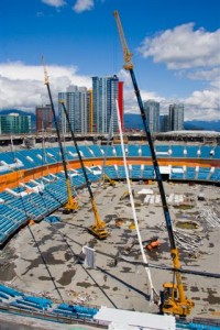 Pacific Blasting & Demolition taking down the last roof cables at BC Place, Vancouver using 3 cranes to disperse the weight and control the cable lowering for removal